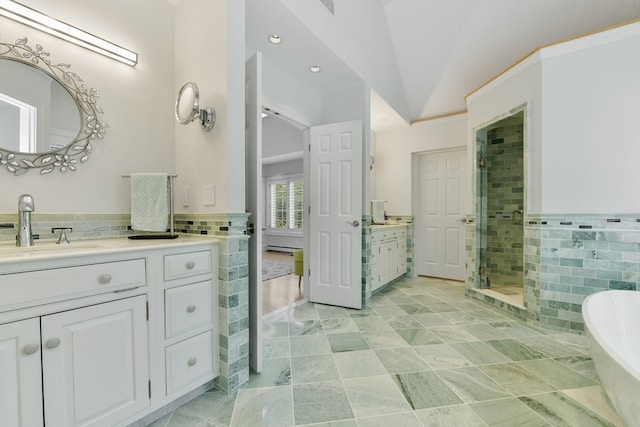 bathroom with tile walls, independent shower and bath, vaulted ceiling, and vanity