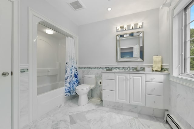 full bathroom with a baseboard heating unit, vanity, toilet, and a healthy amount of sunlight