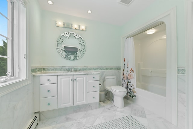 full bathroom featuring a wealth of natural light, vanity, toilet, and tile walls