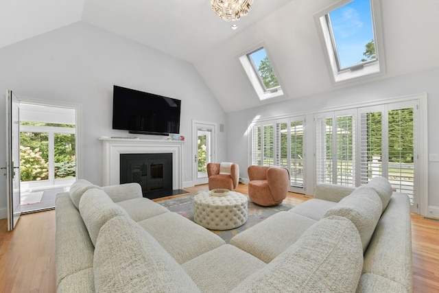 living room with plenty of natural light and light hardwood / wood-style floors