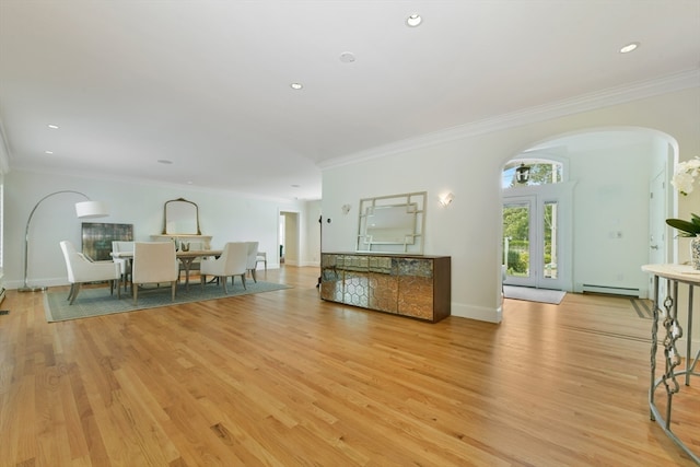 unfurnished living room with a baseboard radiator, crown molding, and light hardwood / wood-style flooring