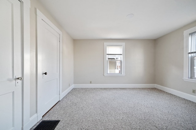 unfurnished room with carpet floors