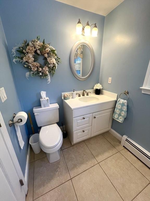 7 Glen Ave, Millbury, MA 01527 - half bath with tile patterned flooring, vanity, toilet, baseboards, and a baseboard radiator