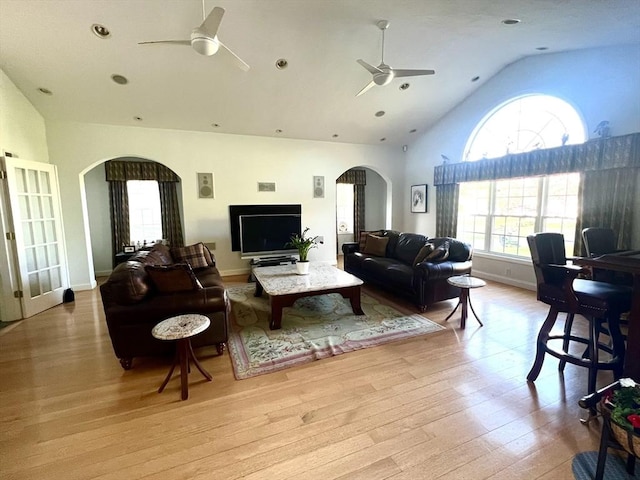 7 Glen Ave, Millbury, MA 01527 - living room featuring arched walkways, high vaulted ceiling, a ceiling fan, baseboards, and wood finished floors