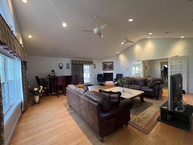 7 Glen Ave, Millbury, MA 01527 - living room with plenty of natural light, a ceiling fan, a wood stove, and light wood finished floors