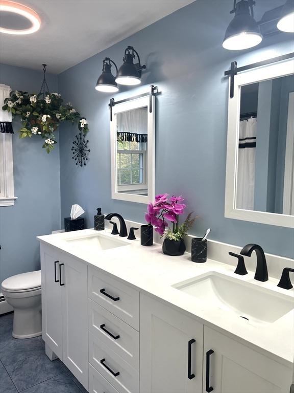7 Glen Ave, Millbury, MA 01527 - bathroom featuring a sink, tile patterned flooring, toilet, and double vanity