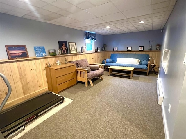 7 Glen Ave, Millbury, MA 01527 - living area featuring light colored carpet, wood walls, a paneled ceiling, a wainscoted wall, and a baseboard heating unit