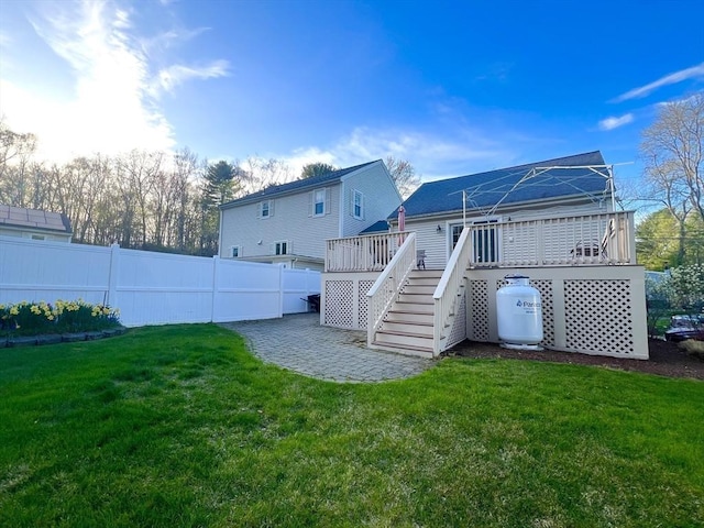 7 Glen Ave, Millbury, MA 01527 - rear view of house featuring stairs, fence, a yard, and a wooden deck