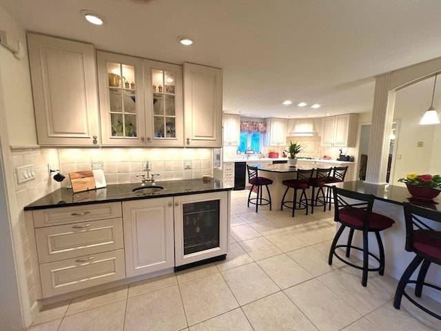 7 Glen Ave, Millbury, MA 01527 - bar with beverage cooler, a sink, light tile patterned floors, and recessed lighting