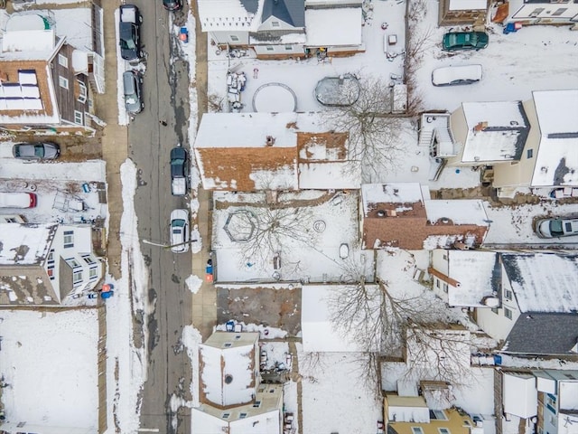 snowy aerial view with a residential view