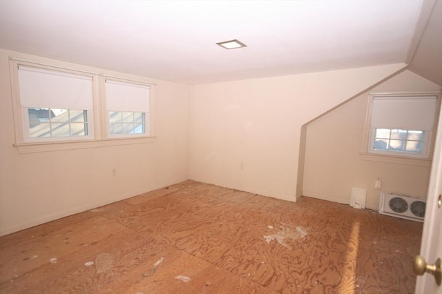 bonus room featuring visible vents and vaulted ceiling