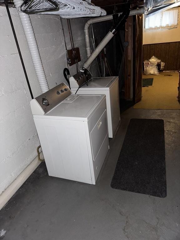 clothes washing area featuring laundry area and washing machine and clothes dryer