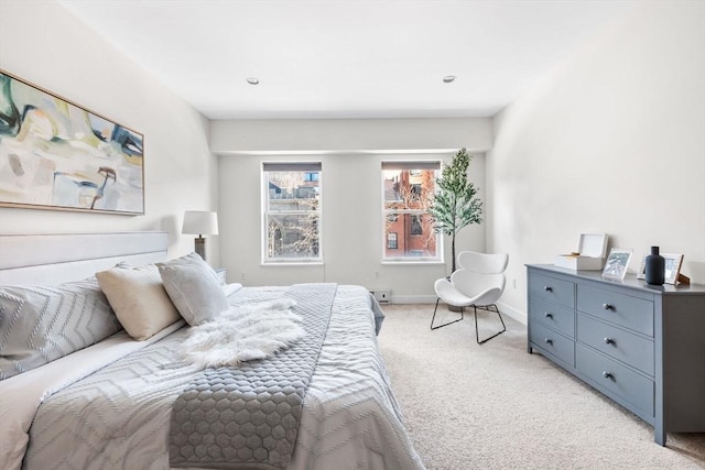 bedroom featuring light colored carpet