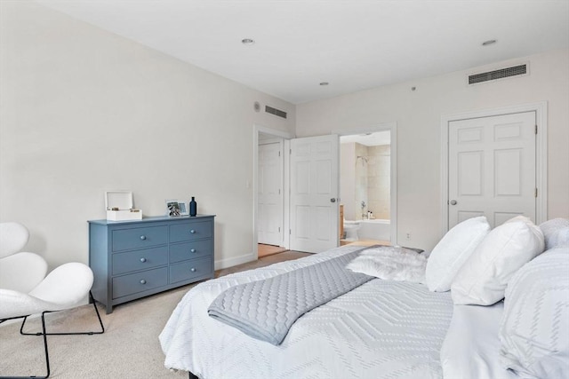 carpeted bedroom with ensuite bathroom