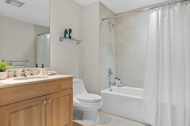 full bathroom featuring shower / tub combo with curtain, vanity, toilet, and tile patterned flooring