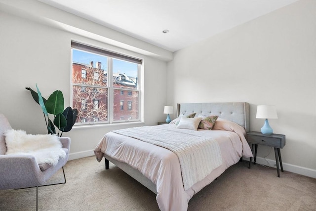 carpeted bedroom featuring multiple windows