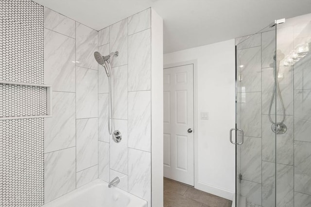 bathroom with tile patterned floors and enclosed tub / shower combo