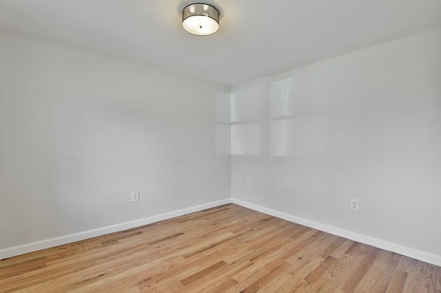 spare room with light hardwood / wood-style flooring