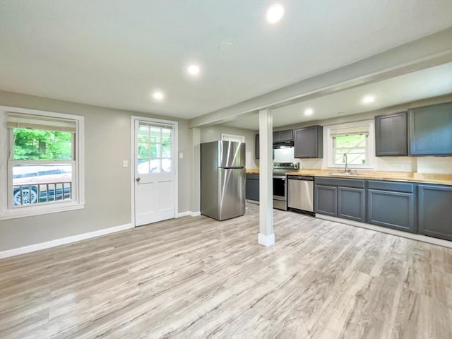 48-50 S Westfield St, Agawam, MA 01030 - kitchen featuring appliances with stainless steel finishes, a sink, light wood-style flooring, light countertops, and recessed lighting