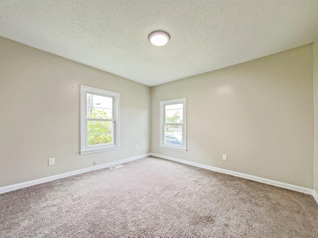 48-50 S Westfield St, Agawam, MA 01030 - carpeted empty room with a textured ceiling and baseboards