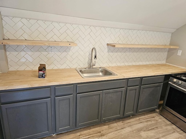 48-50 S Westfield St, Agawam, MA 01030 - kitchen with open shelves, a sink, stainless steel range with gas cooktop, and decorative backsplash