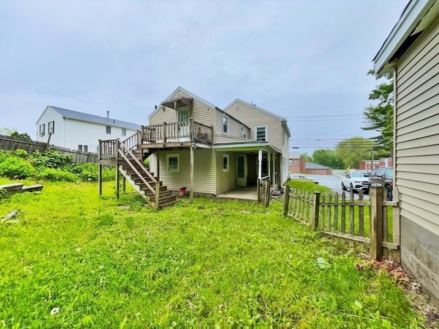 48-50 S Westfield St, Agawam, MA 01030 - rear view of house with a wooden deck and stairway