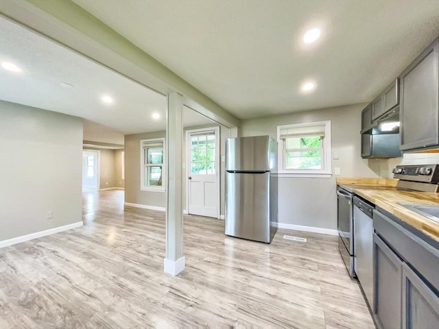 48-50 S Westfield St, Agawam, MA 01030 - kitchen with stainless steel appliances, baseboards, recessed lighting, and light wood finished floors