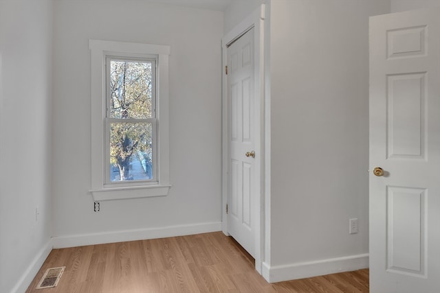 spare room with light hardwood / wood-style flooring