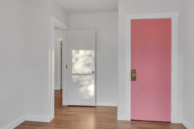 unfurnished room with light wood-type flooring