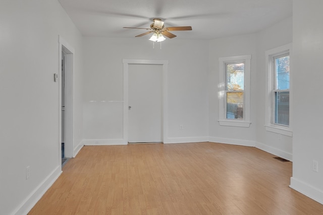 unfurnished room featuring light hardwood / wood-style floors and ceiling fan