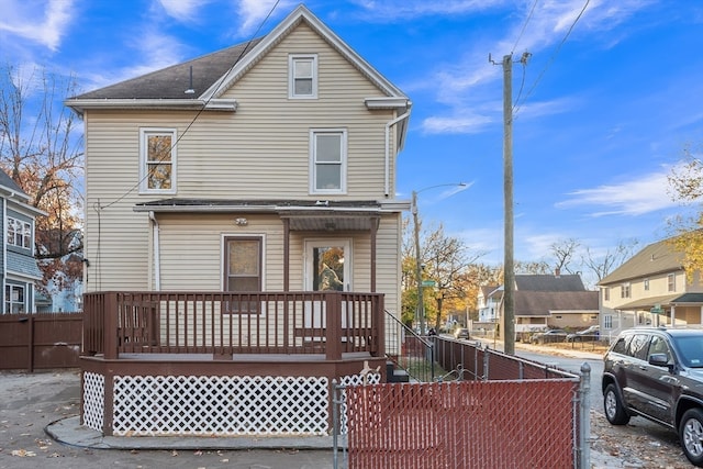 back of house featuring a deck