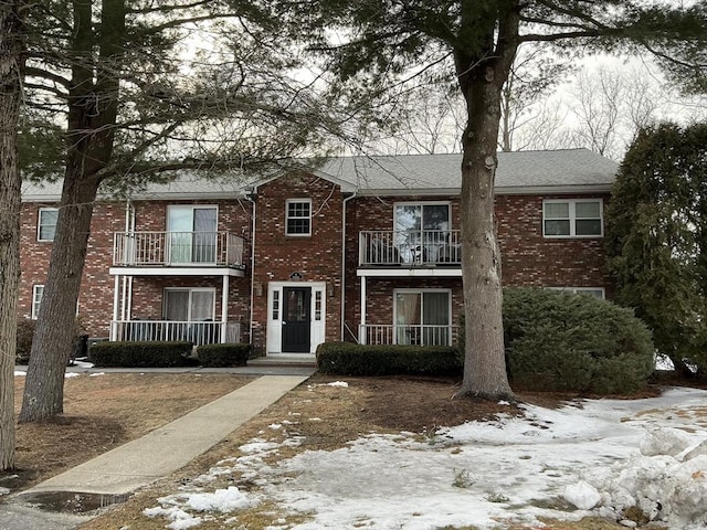 view of property with brick siding