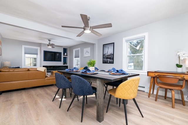 dining room featuring light wood-type flooring and ceiling fan