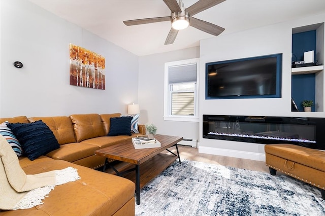 living room with ceiling fan, hardwood / wood-style floors, and a baseboard heating unit