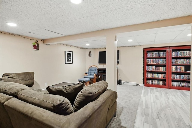 644 Stony Hill Rd, Wilbraham, MA 01095 - living room featuring recessed lighting, a paneled ceiling, a baseboard heating unit, and wood finished floors