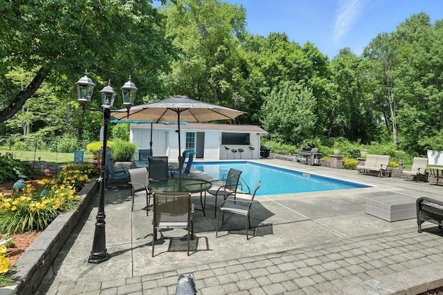 644 Stony Hill Rd, Wilbraham, MA 01095 - view of pool with a patio area, an outbuilding, a grill, and an exterior structure