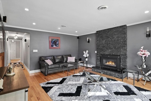644 Stony Hill Rd, Wilbraham, MA 01095 - living room featuring wood finished floors, ornamental molding, a fireplace, recessed lighting, and a baseboard radiator