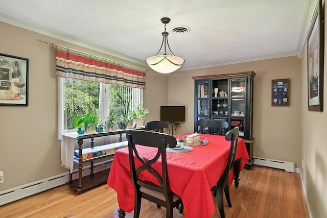 644 Stony Hill Rd, Wilbraham, MA 01095 - dining space with a baseboard radiator, ornamental molding, light wood-type flooring, and baseboard heating