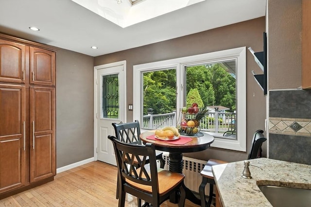 644 Stony Hill Rd, Wilbraham, MA 01095 - dining room featuring a skylight, light wood-style floors, and recessed lighting