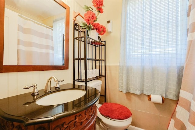 bathroom featuring toilet and vanity