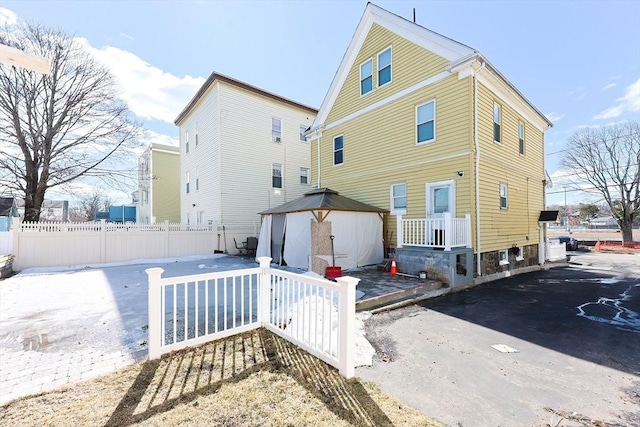 back of property with fence