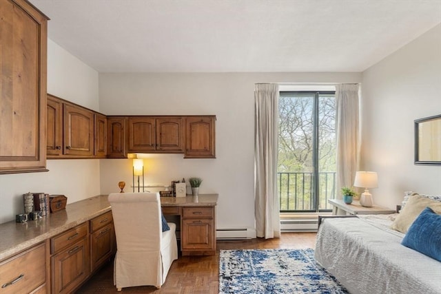 bedroom featuring a baseboard heating unit