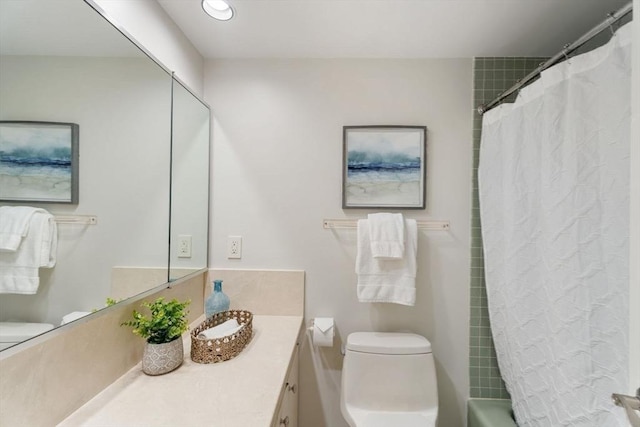 full bath featuring vanity, recessed lighting, and toilet