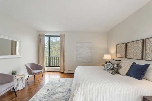 bedroom with a baseboard radiator and access to exterior