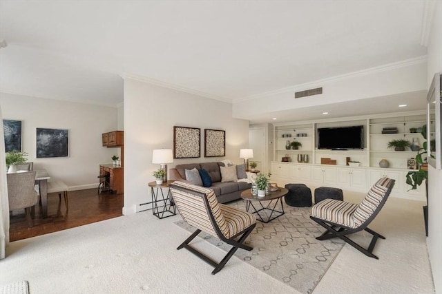 living area with visible vents, ornamental molding, light carpet, baseboards, and a baseboard heating unit