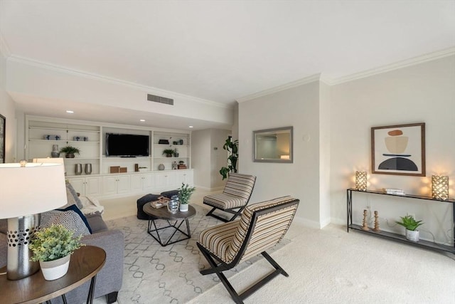 living area featuring visible vents, built in shelves, baseboards, ornamental molding, and carpet flooring