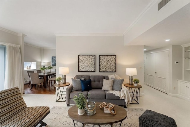 living area with baseboards, visible vents, ornamental molding, and a baseboard radiator