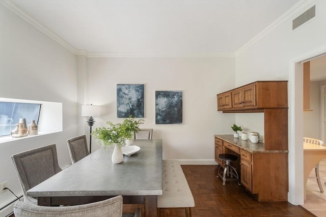 dining area featuring crown molding, baseboards, and visible vents