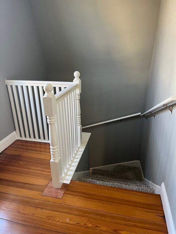 staircase featuring hardwood / wood-style flooring