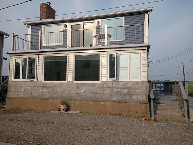 6 Tilden Ave, Scituate, MA 02066 - view of front facade featuring a balcony and a chimney